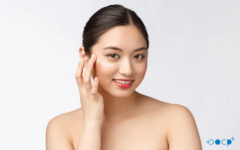 Woman Brushes Her Face With One Finger