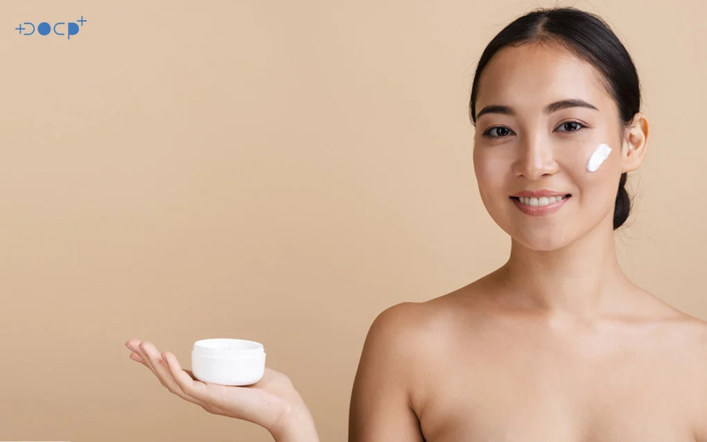 Woman Posing The Product On Her hand With Cream On Her Cheek